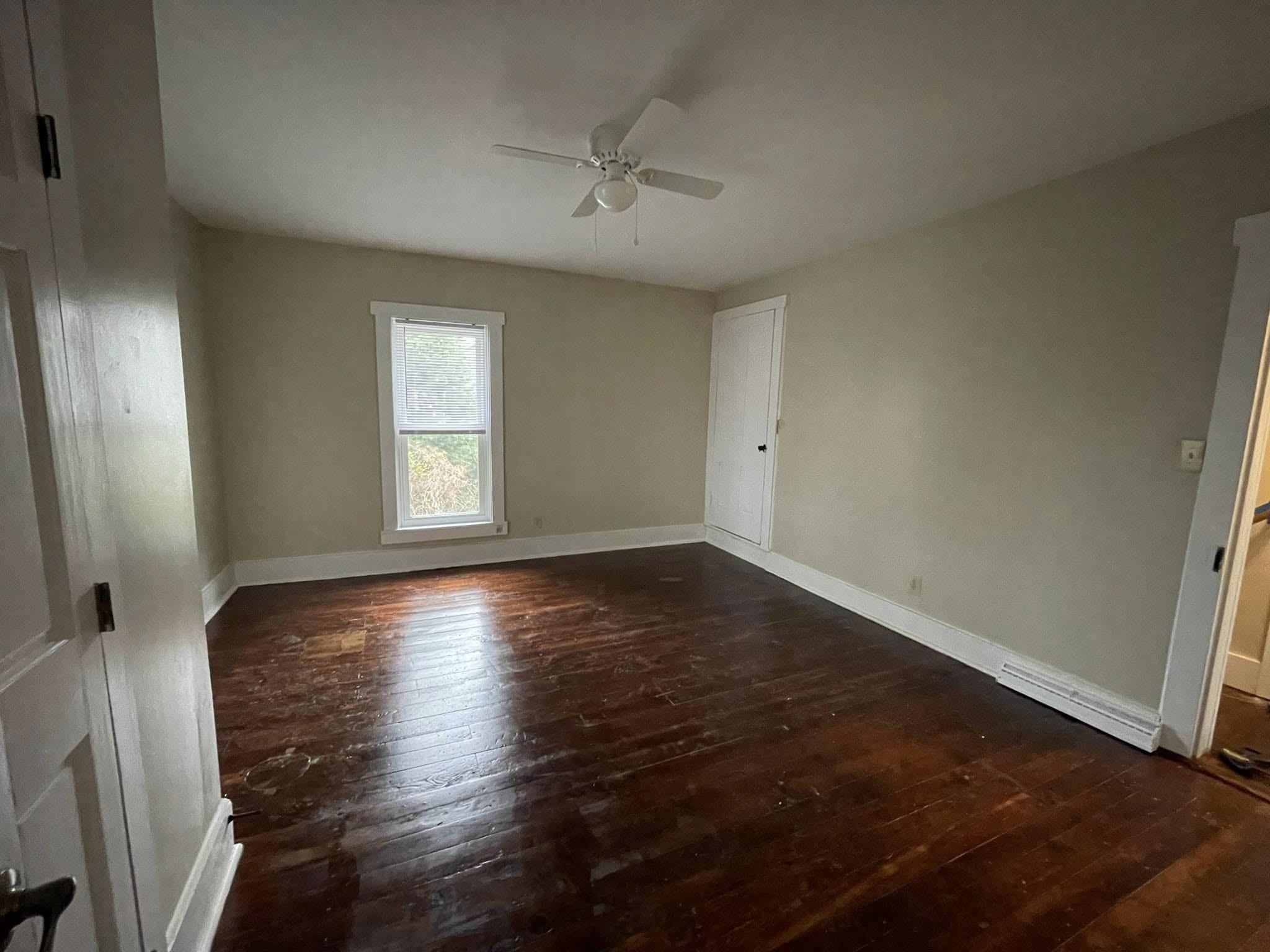 A freshly painted interior room with clean finished drywall