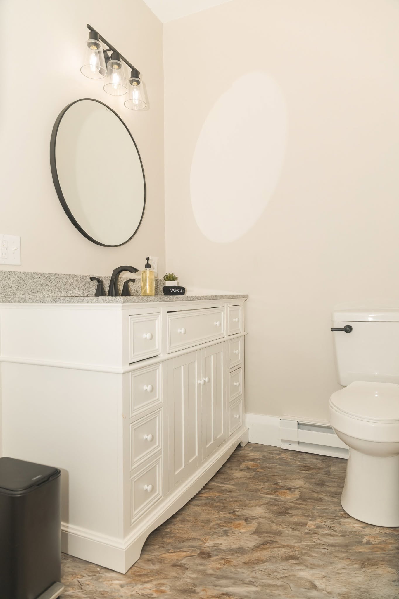 A new bathroom vanity with fixtures and mirror